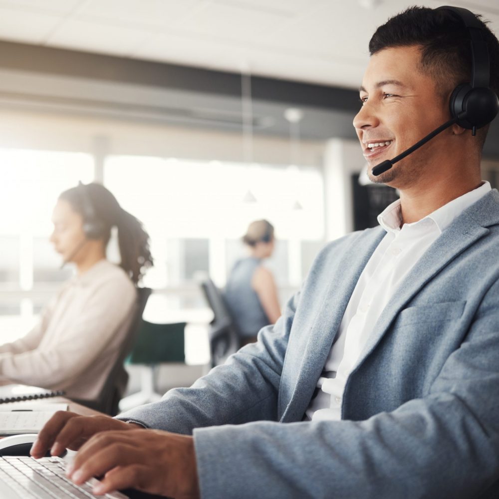 Customer support, happy consultant and man telemarketing communication on contact us CRM or telecom microphone. Call center administration, ecommerce ERP and information technology consulting online.